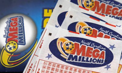 Photo of Mega Millions lottery tickets and logo