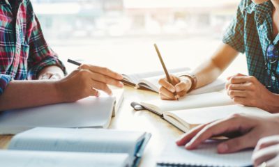 Photo of students taking notes